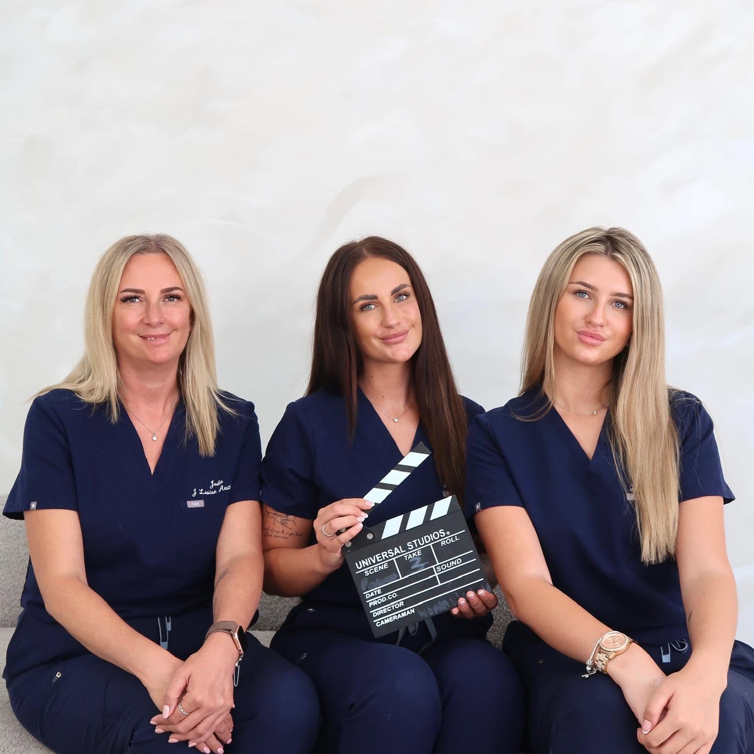 J Louise Aesthetics team in navy scrubs